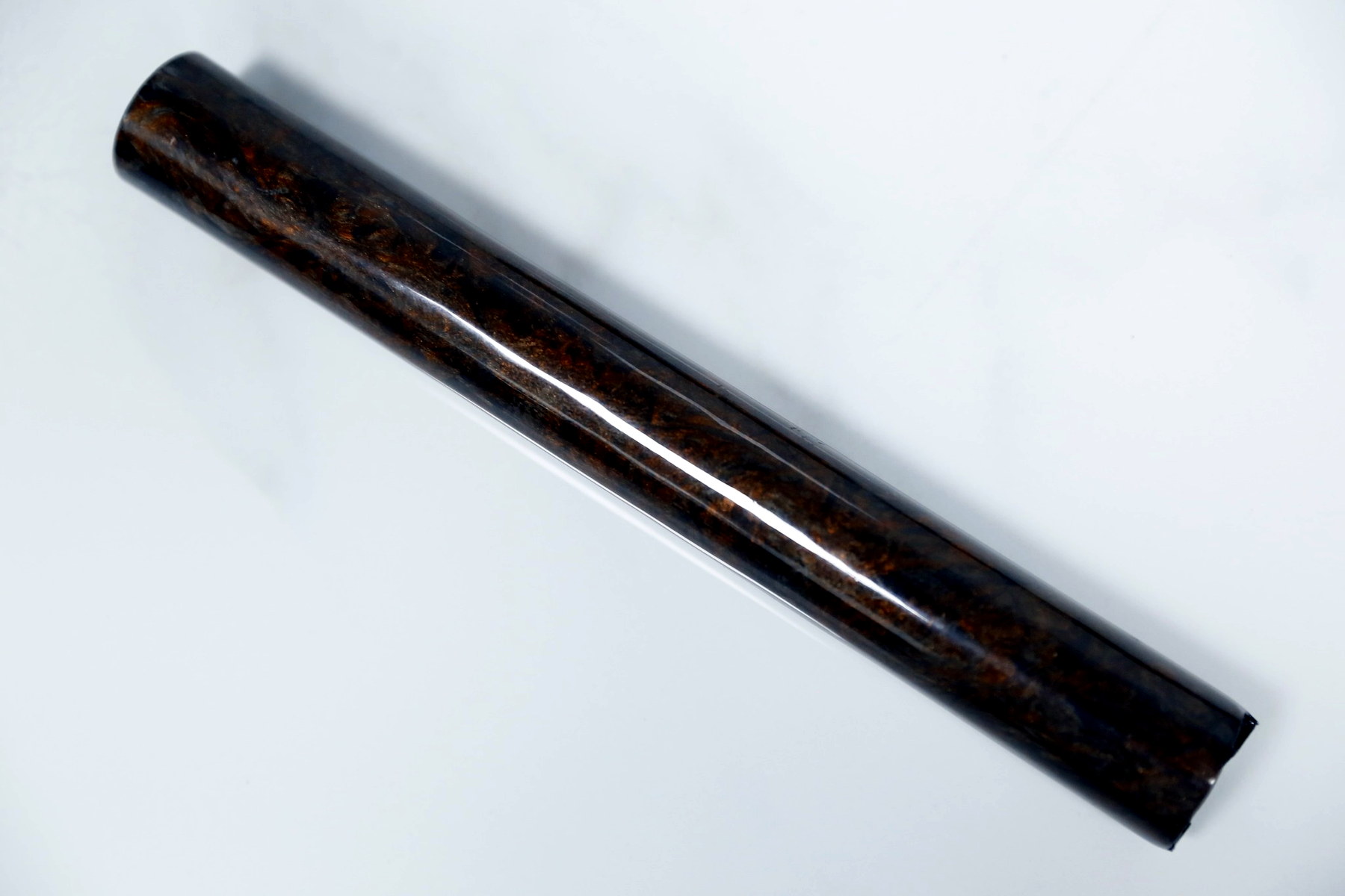 Rose gold metallic forged carbon fiber tube with warm metallic luster