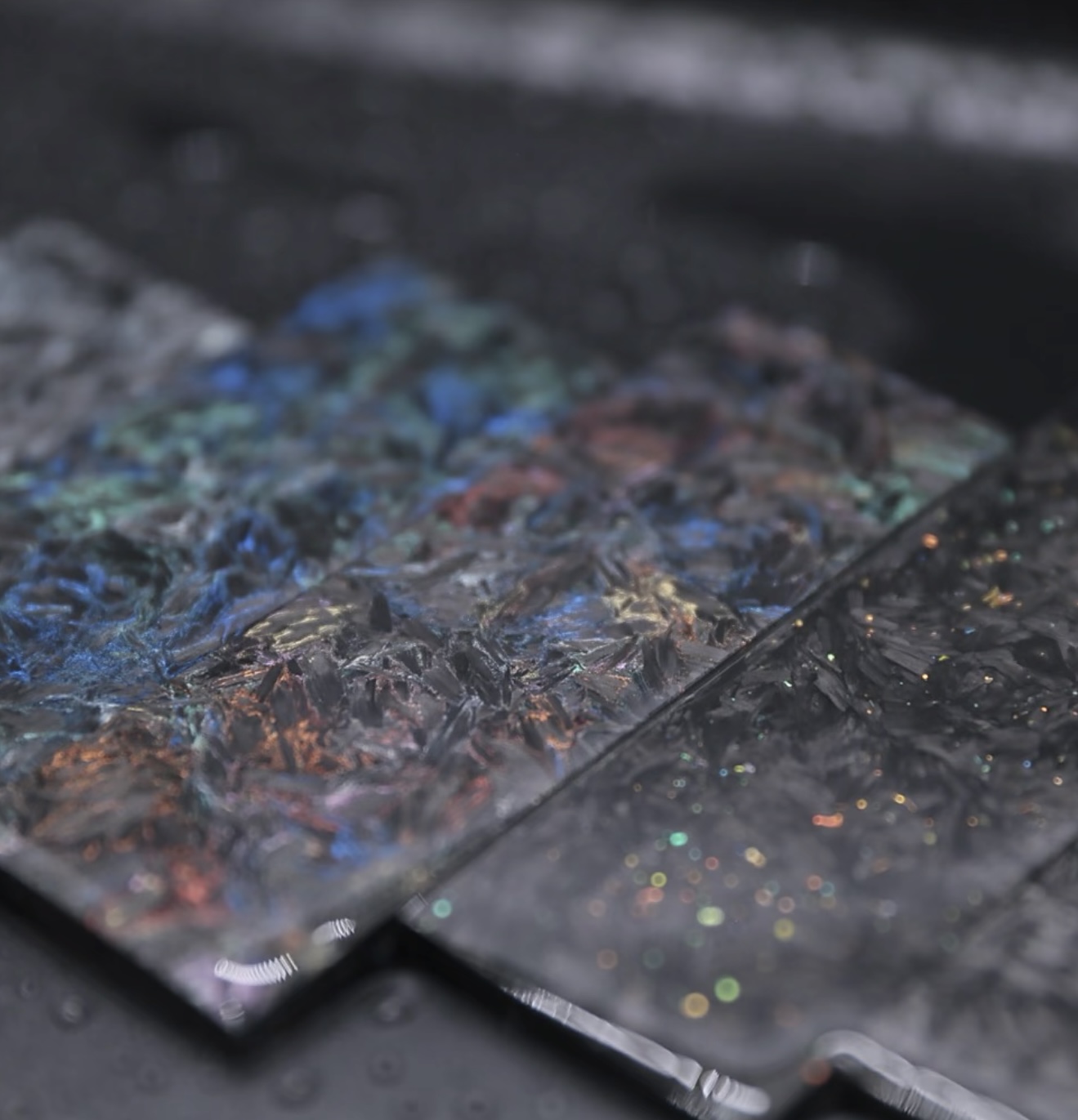 Spark Collection luminous forged carbon composite sheet and panel material with bright glow and energetic color effects for premium design.