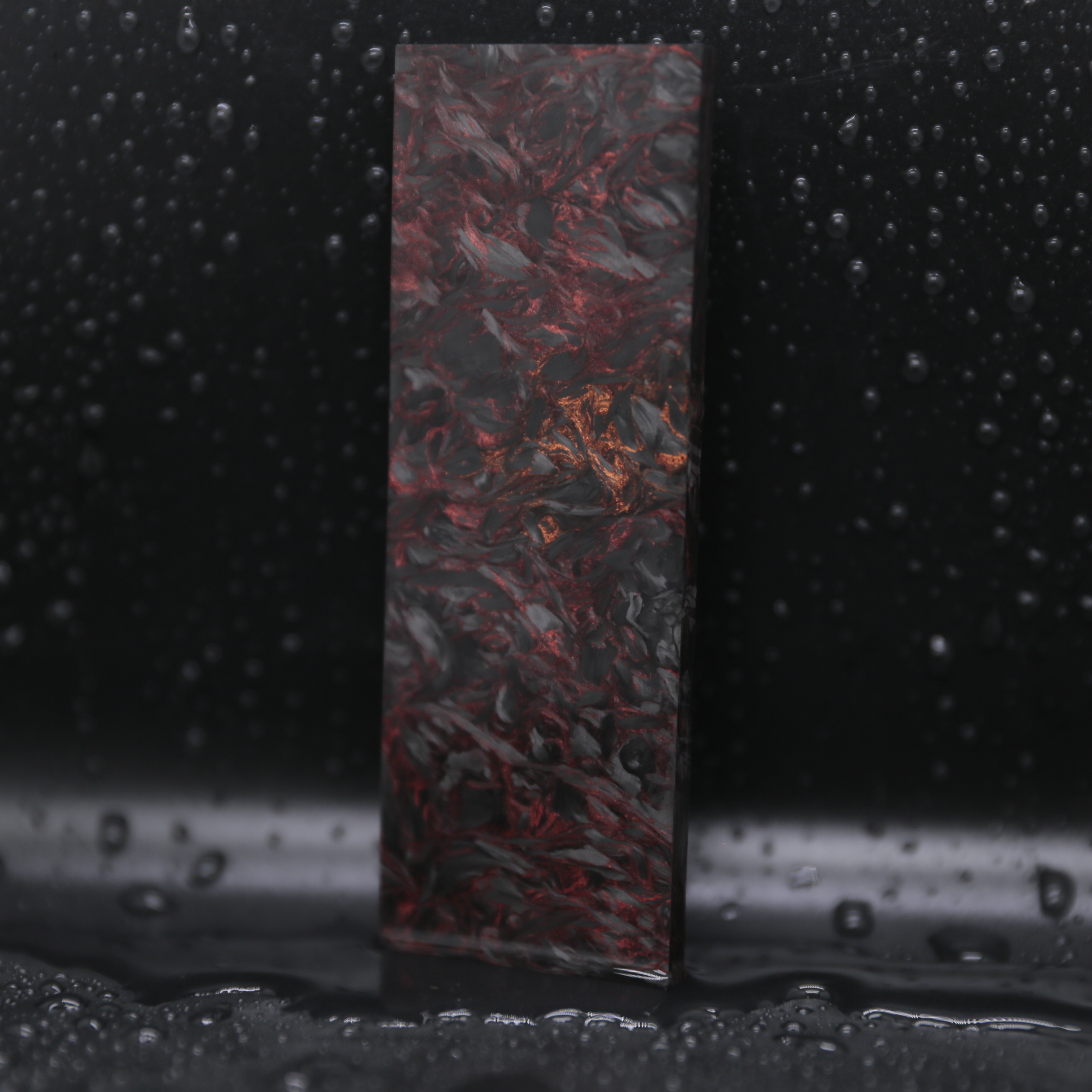 Obsidian Gold Collection forged carbon composite sheet and panel material with black and gold metallic highlights for luxury products.