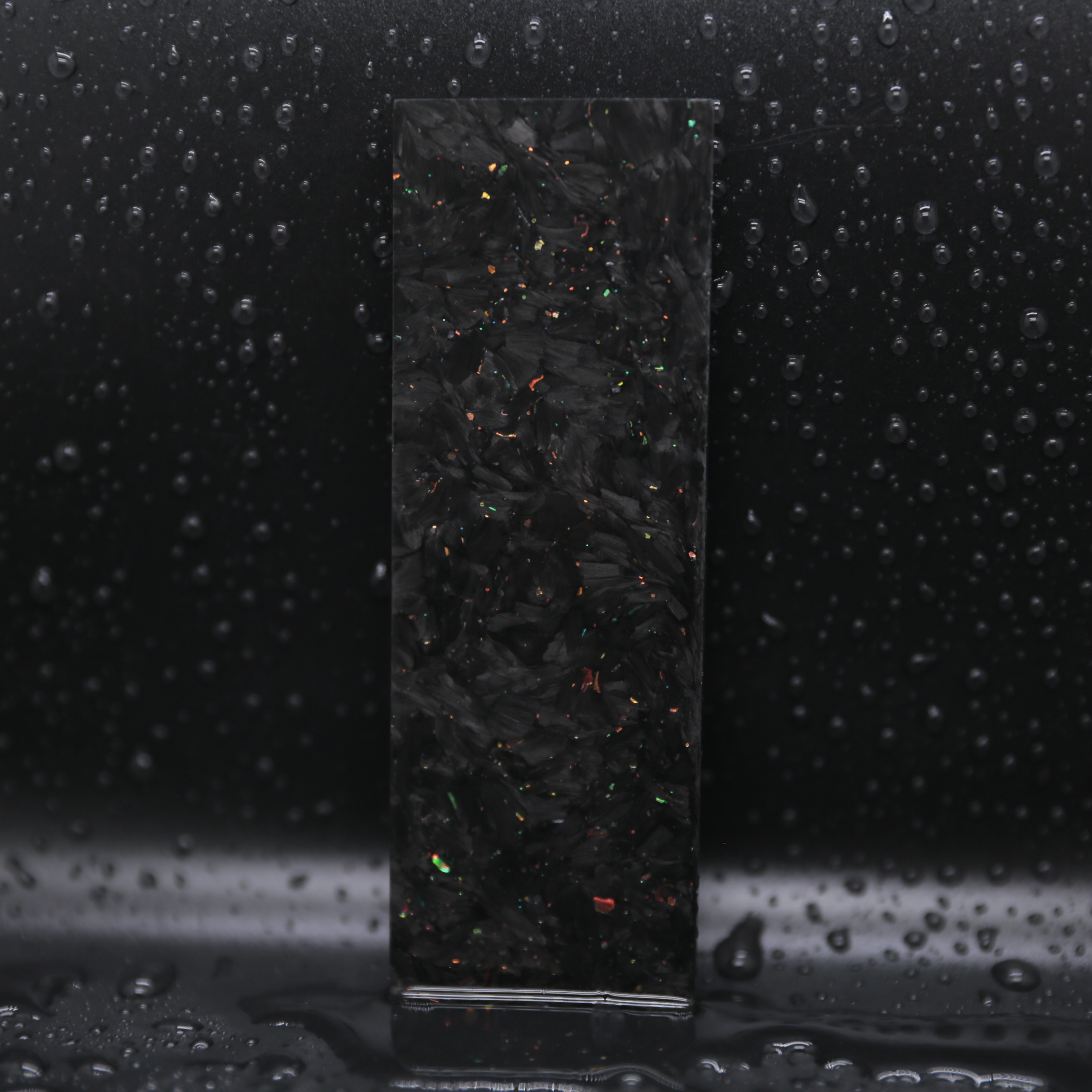 Spark Collection luminous forged carbon composite block material with bright glow and energetic color effects for premium design.