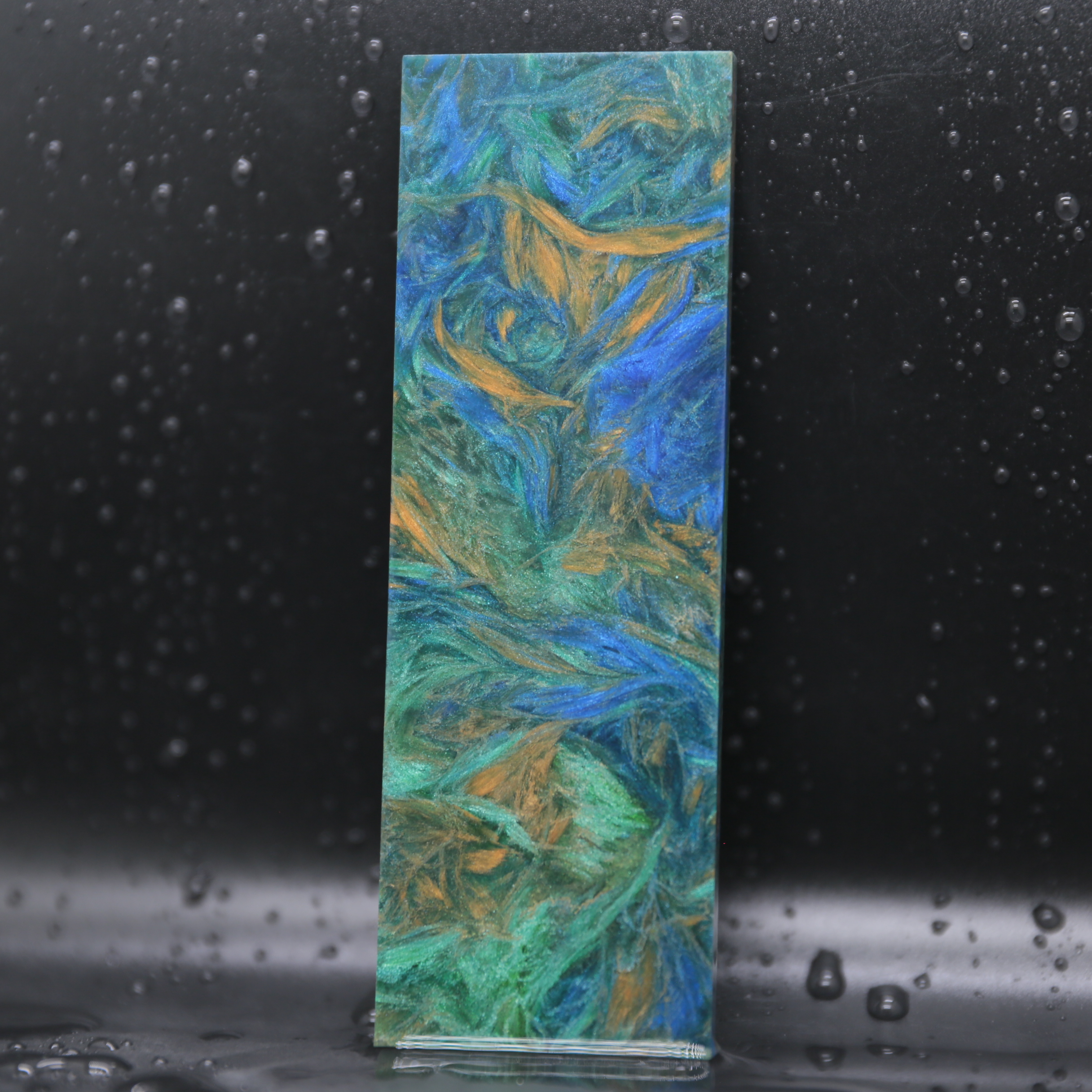 Night Collection forged carbon composite material with hidden blue emerald copper or violet tones for luxury products.