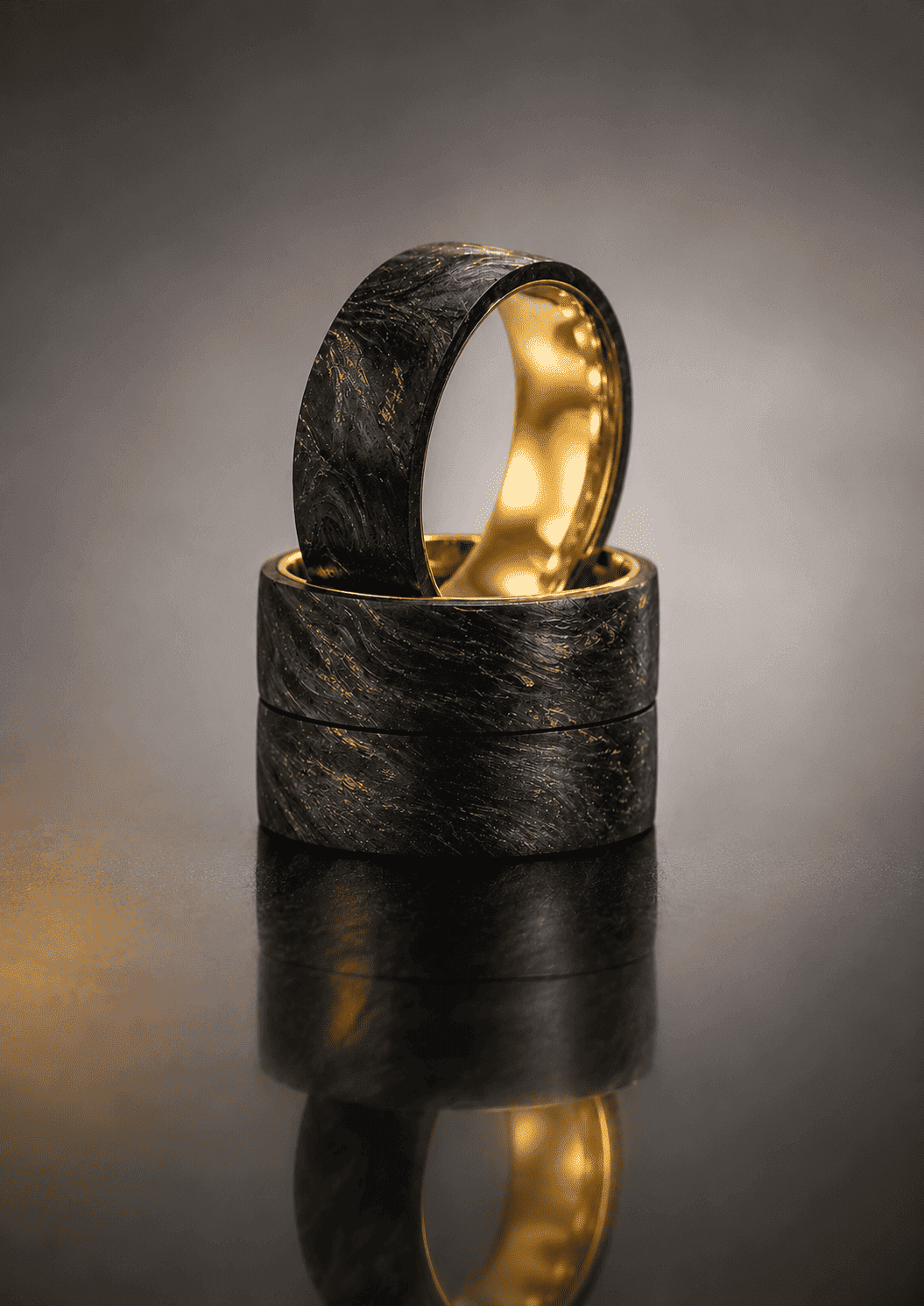 Black carbon fiber tube with a golden ring at the top